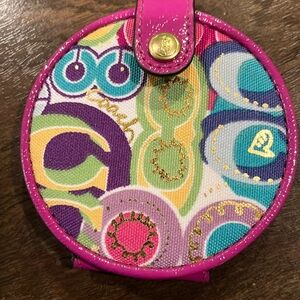 Coach 3.5 inch picket book mirror. One side magnifying. Barely used.